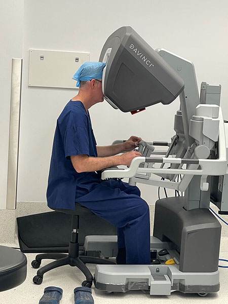 Dr Meade controlling the robot from the surgeon console