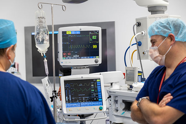 Surgeons at machines